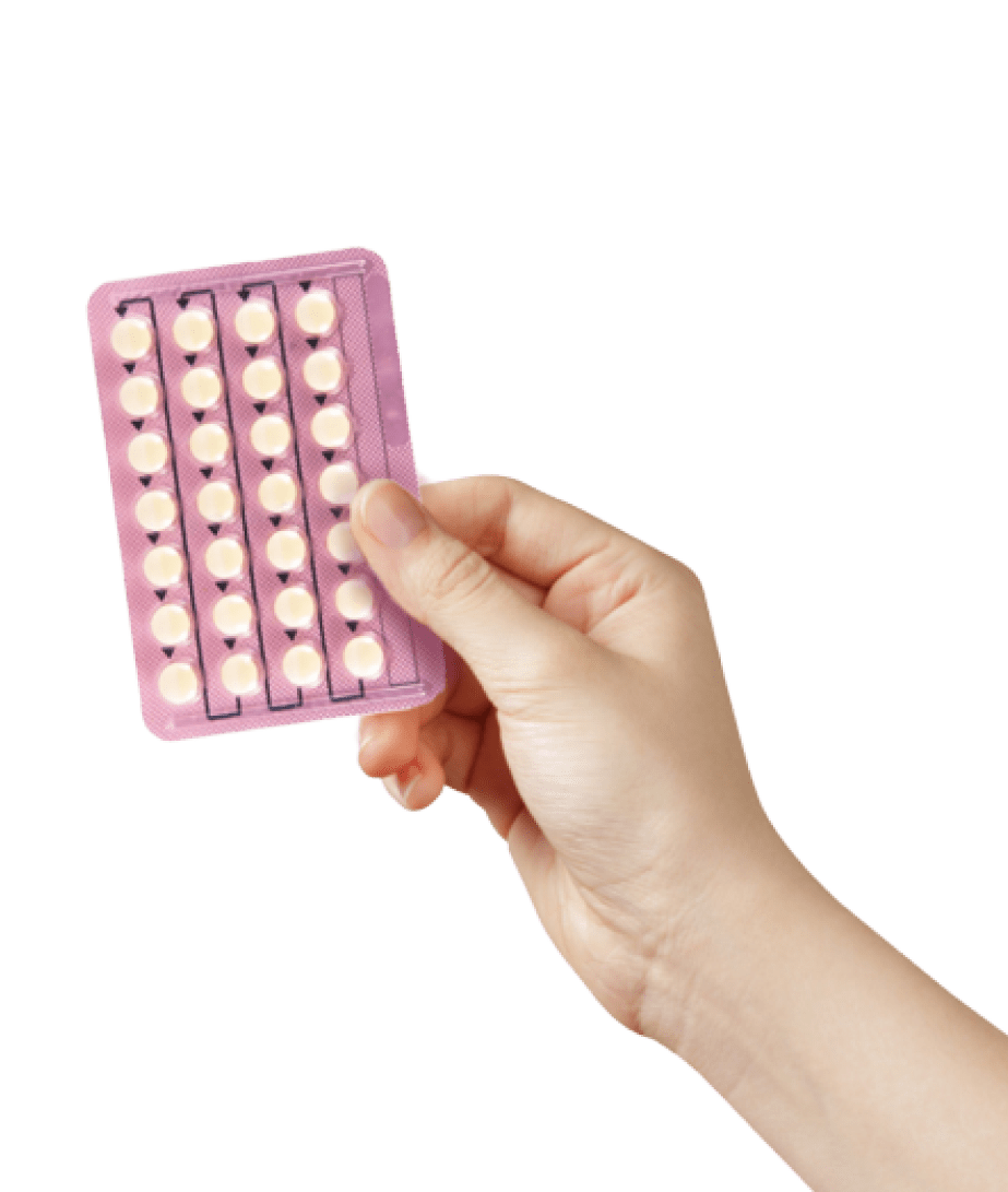 hand holding birth control pills